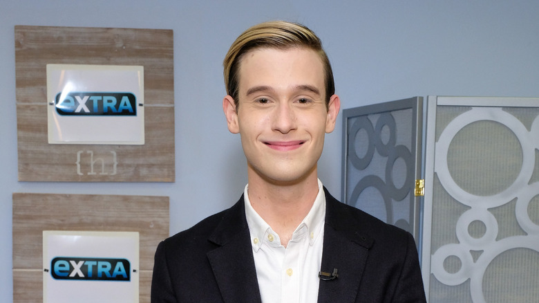 Tyler Henry smiling at Extra in 2016