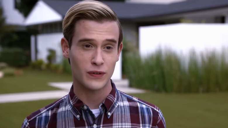 Tyler Henry standing outside talking to camera