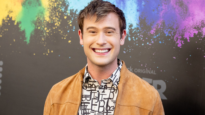 Tyler Henry smiling at the premiere of "Queer as Folk" in 2022