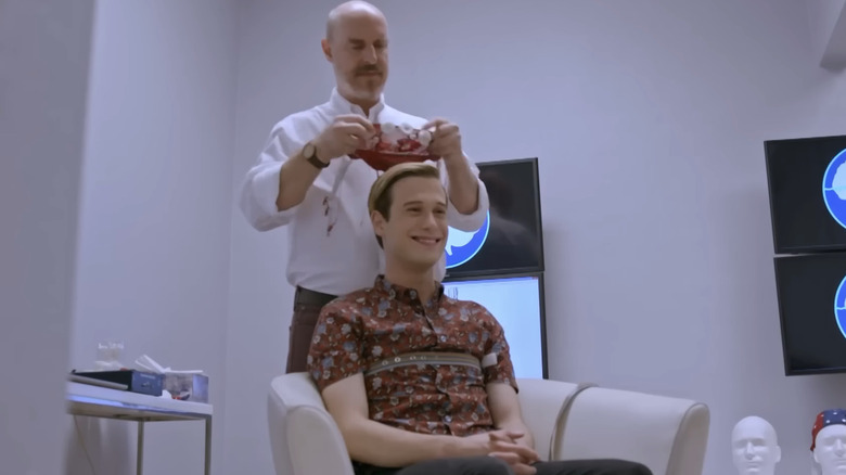 Dr. Andrew Hill preparing to conduct a brain scan on Tyler Henry