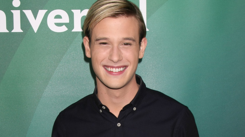 Tyler Henry smiling at NBC Winter press day in 2016