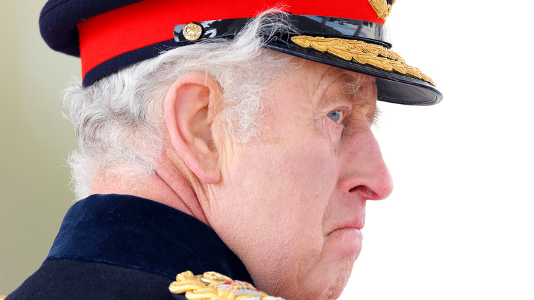 King Charles III military uniform hat frowning