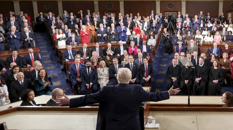 Donald Trump stands to deliver the State of the Union to joint members of Congress in Washington, DC (2026)