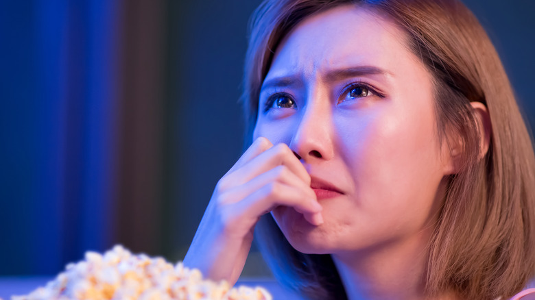 Woman crying watching TV
