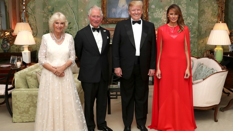 Queen Camilla and King Charles III posing with Donald Trump and Melania Trump at Winfield House