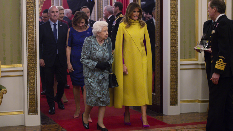 Melania Trump walking with Queen Elizabeth II