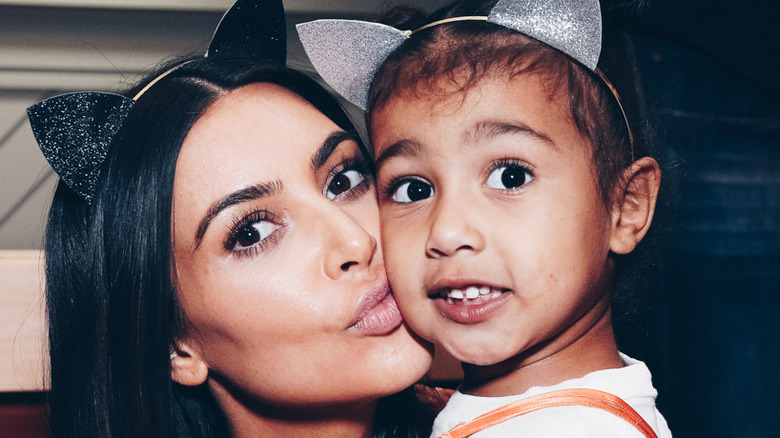 Kim Kardashian West kissing North West