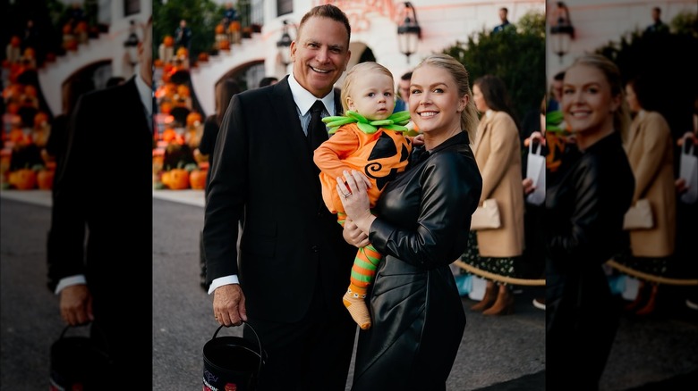 Karoline Leavitt poses with her husband and baby during a Halloween trick-or-treating event