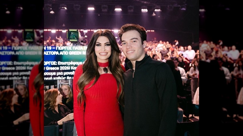 Kimberly Guilfoyle poses for a photo with her son at "Sing For Greece"