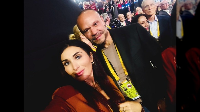 Laura Loomer poses for a selfie with former Deputy FBI Director Dan Bangino, with part of her face in shadow