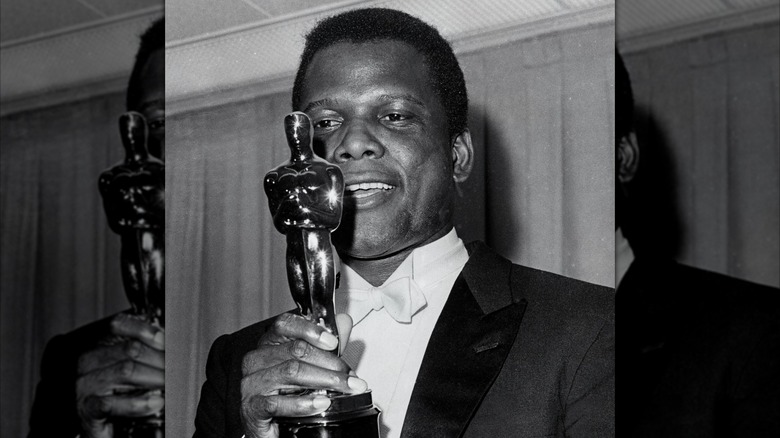 Sidney Poitier holding his Oscar for Lilies of the Field