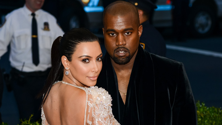 Kanye West and Kim Kardashian attending an event
