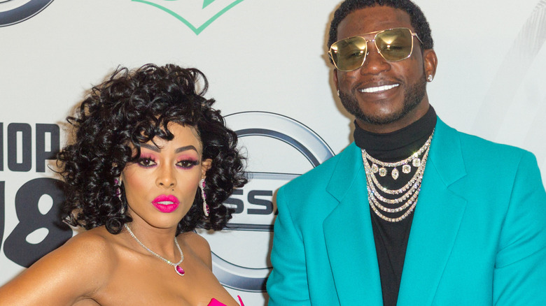 Keyshihia Ka'Oir and Gucci Mane attending an event