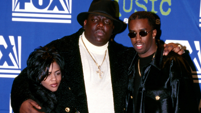 Lil Kim and Biggie at an event with Sean Combs
