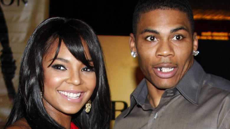 Nelly and Ashanti attending an event