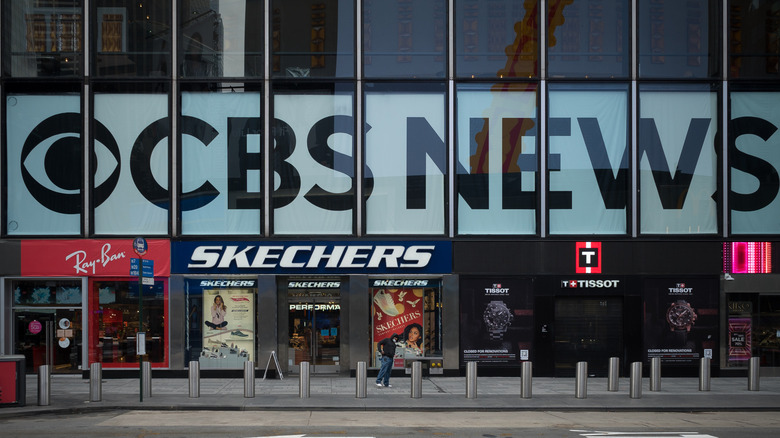 A large sign that reads CBS NEWS in the windows of a building.