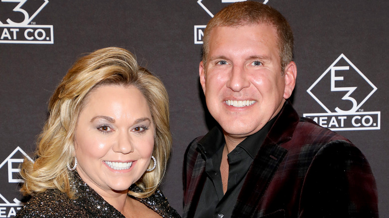 Julie Chrisley (L) and Todd Chrisley attend the grand opening of E3 Chophouse Nashville on November 20, 2019 in Nashville, Tennessee (2019)