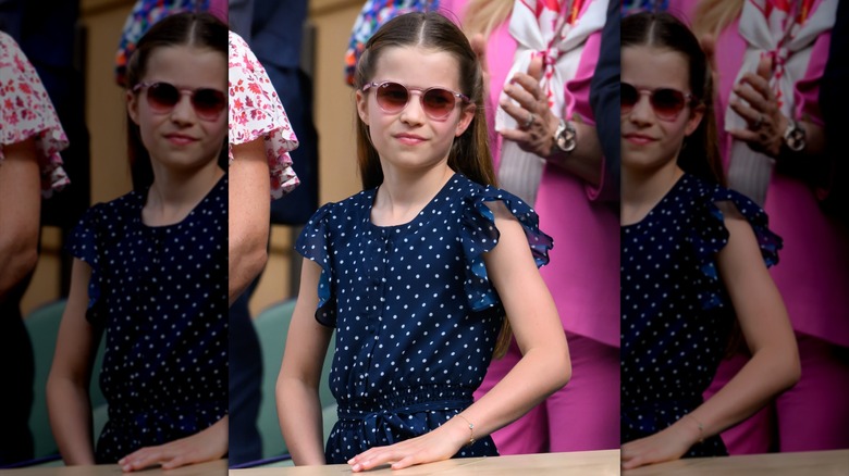 Princess Charlotte smiling in sunglasses