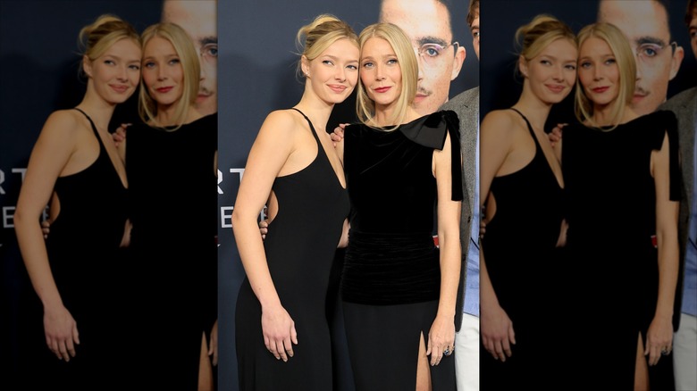 Apple Martin standing alongside her mother, Gwyneth Paltrow, at the Marty Supreme premiere in black dresses