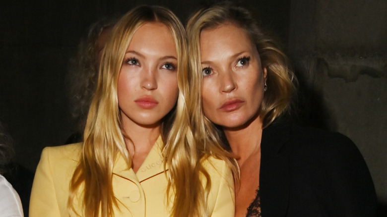 Kate and Lila Moss pouting side by side at a Gucci fashion show