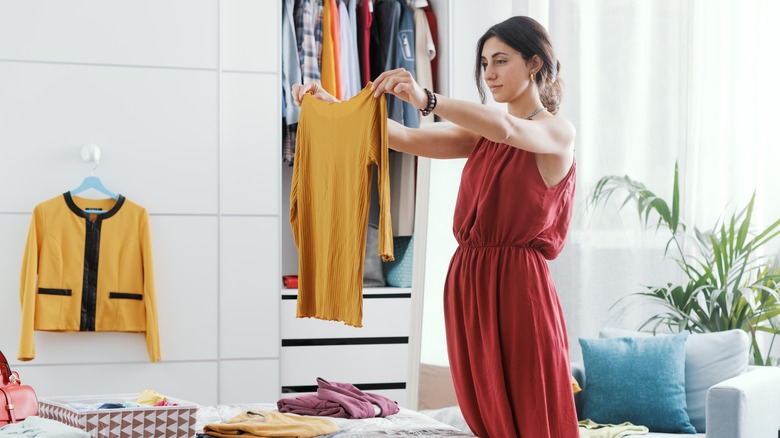 Woman picking outfit 