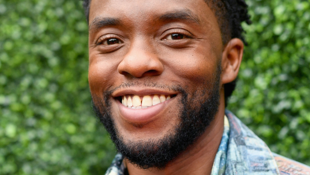 Chadwick Boseman smiling outside