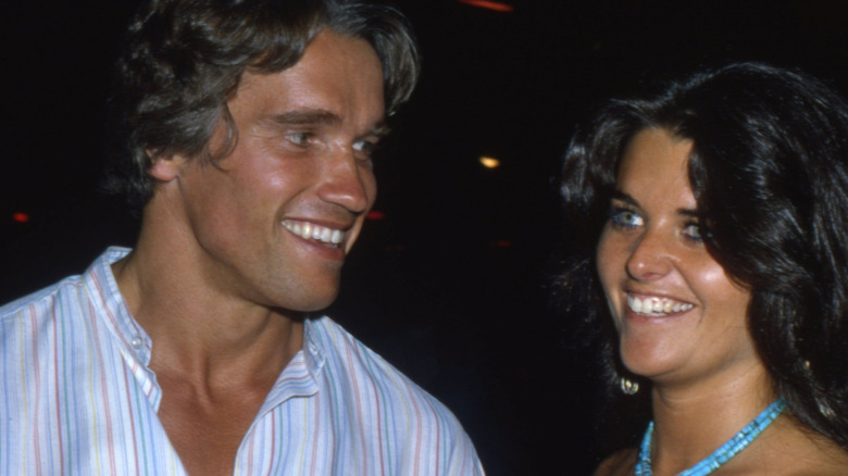 Arnold Schwarzenegger and Maria Shriver smiling in 1980