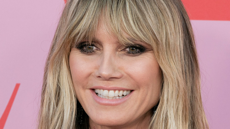 Heidi Klum smiling in a close up