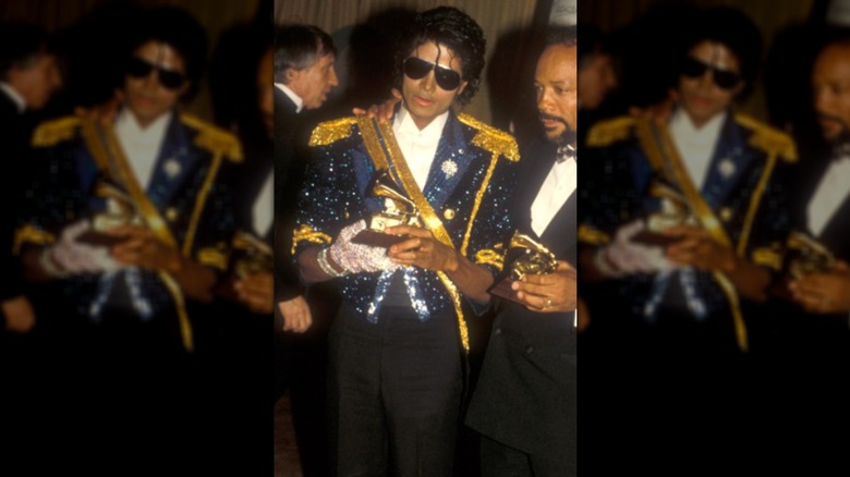Michael Jackson in military inspired sequin jacket and sunglasses with a white shirt