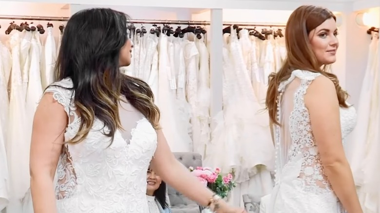 "Say Yes to the Dress: U.K." two brides standing in showroom wearing wedding dresses