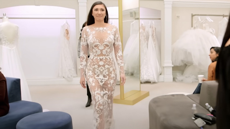 Alexis Wirth walking through Kleinfeld in a 'naked' wedding dress