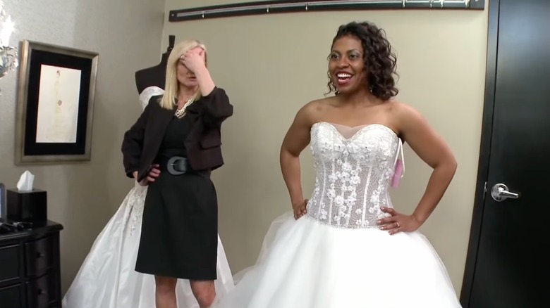 Shaundalyn Elliott trying on sheer bodice dress