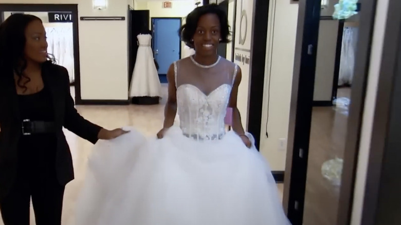 Tameria James trying on a sheer bodice dress on "Yes Yes to the Dress: Atlanta"