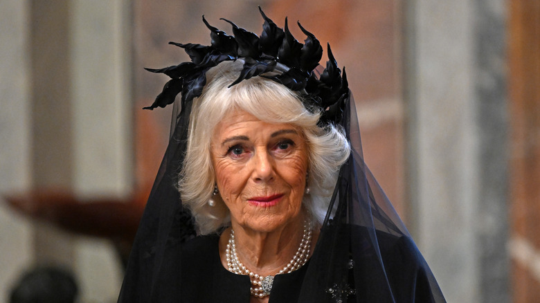 Closeup of Queen Camilla wearing black veil and headpiece at the Vatican
