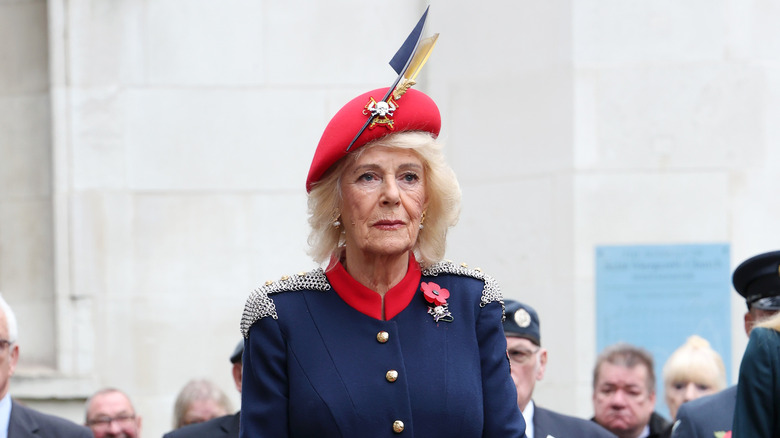 Queen Camilla standing in respect at 97th Field of Remembrance ceremony