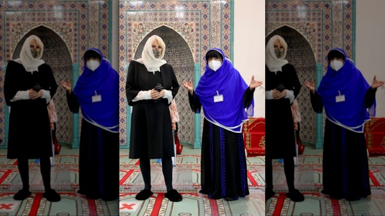 Camilla, Queen Consort, and tour guide in mosque