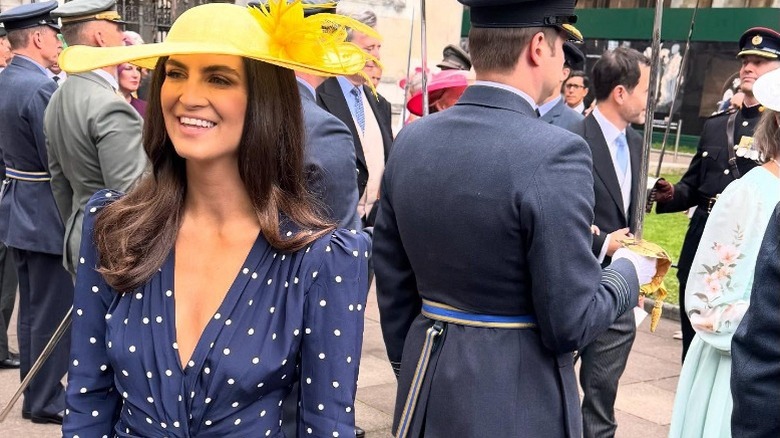 Kaitlan Collins wears a blue and white polka dot dress to visit Big Ben in London, England (2025)