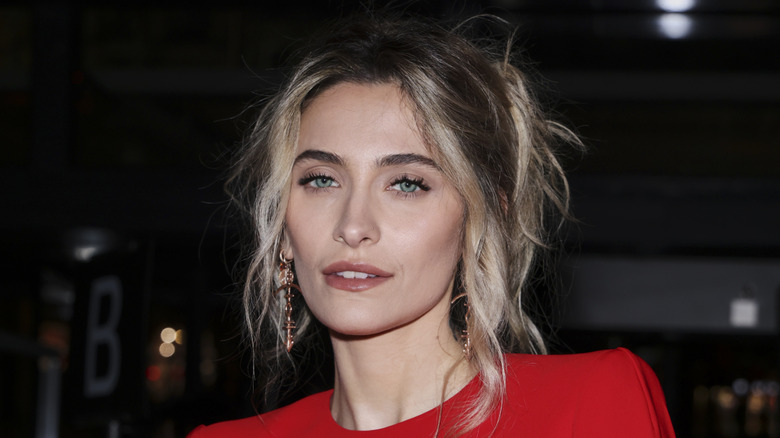 Close up on Paris Jackson in a red dress.