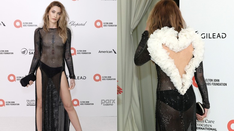 Paris Jackson in a sheer black dress with a white heart ruffle cutout in the back on a red carpet