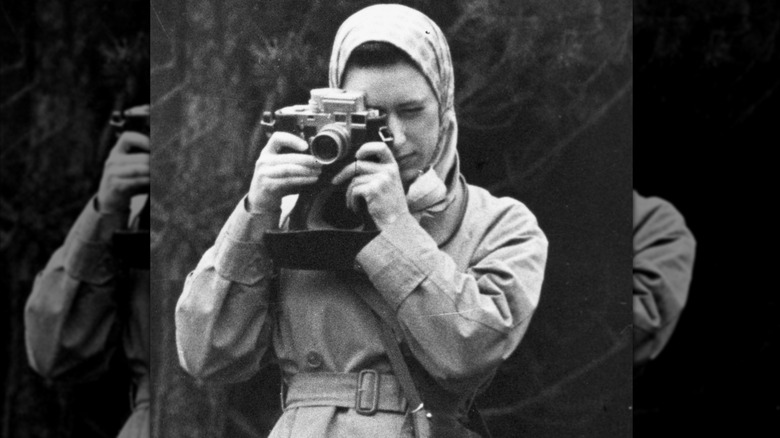 Princess Margaret taking a photo in 1959