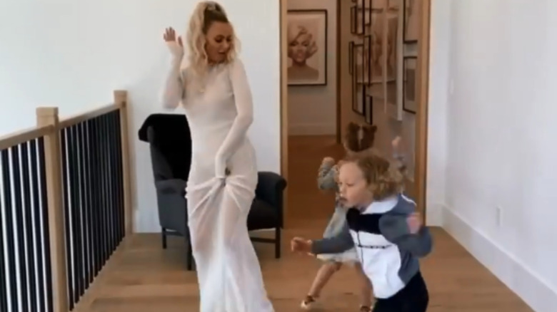 Dorit Kemsley wearing see-through dress while dancing with kids