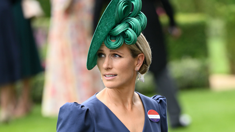 Zara Tindall wearing a green hat 