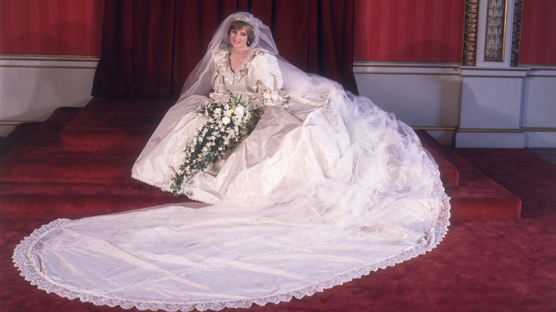 Princess Diana sitting in wedding gown