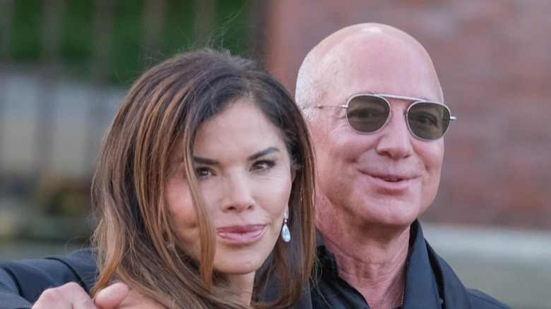 Jeff Bezos with his arm around Lauren Bezos.