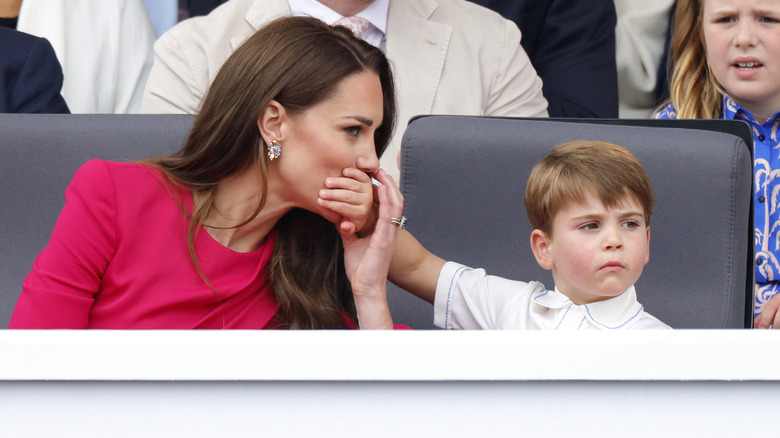 Prince Louis covering Princess Catherine's mouth with his hand during the 2022 Platinum Jubilee