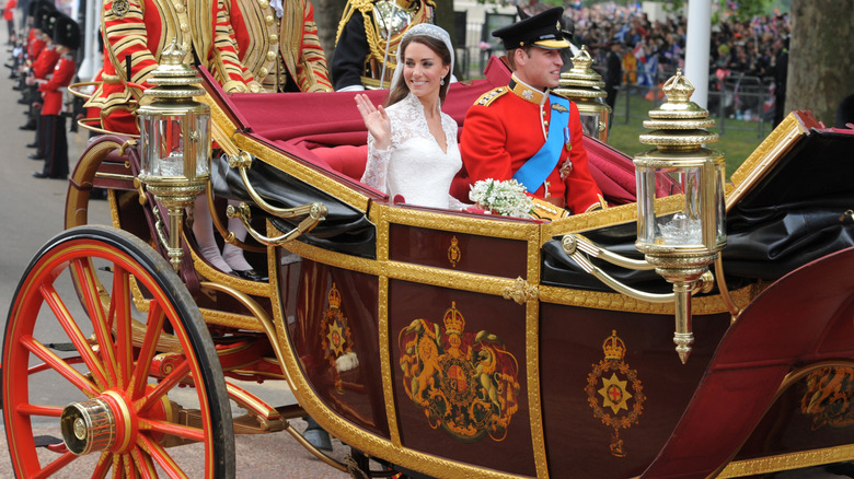 Kate Middleton and Prince William riding in a carriage on their wedding day