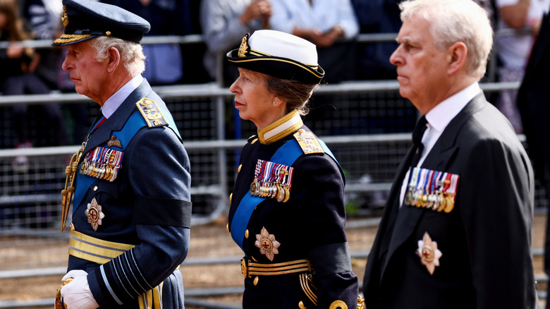King Charles, Princess Anne, and Prince Andrew in line