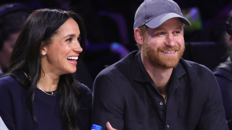 Meghan Markle and Prince Harry watch an NBA game