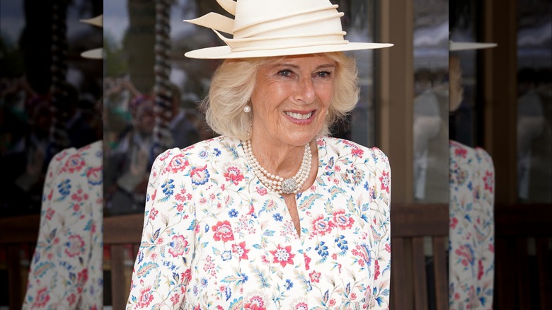 Queen Camilla wearing a floral dress in 2025