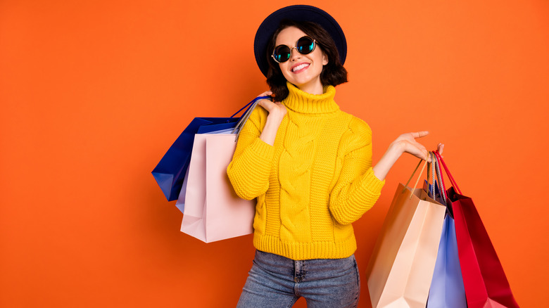 Woman carrying multiple shopping bags